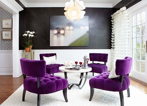 living room with purple chairs
